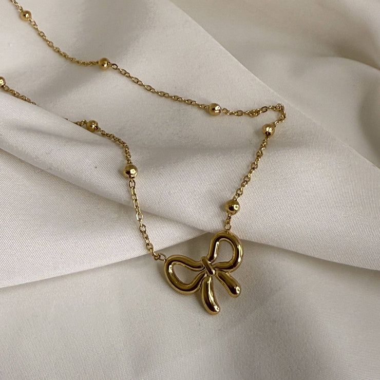 Golden Whisper Bow Necklace