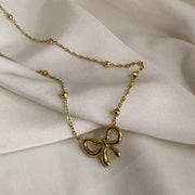 Golden Whisper Bow Necklace