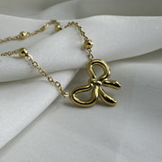 Golden Whisper Bow Necklace